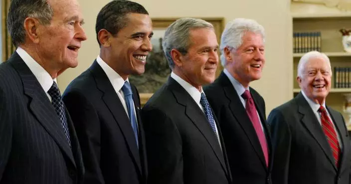 Trump goes unmentioned but not ignored as Clinton, Bush and Obama step up as essayists on presidents