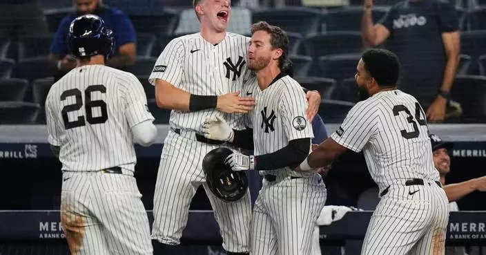 Yankees rally with 2 outs in 9th inning and beat Braves 3-2 in 10 after long rain delay