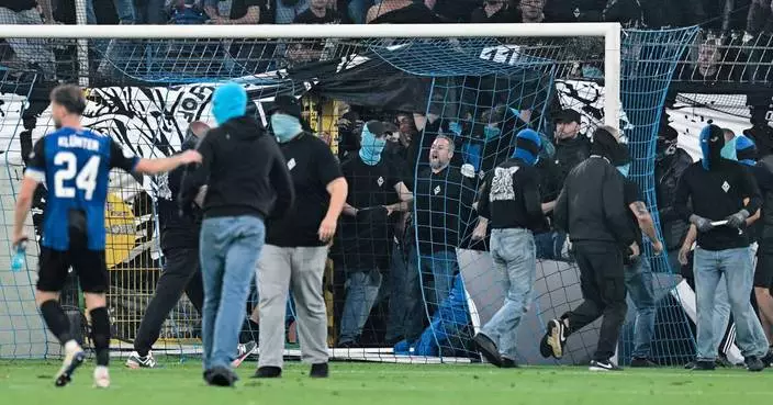 German Cup match marred by fireworks, pitch invasion