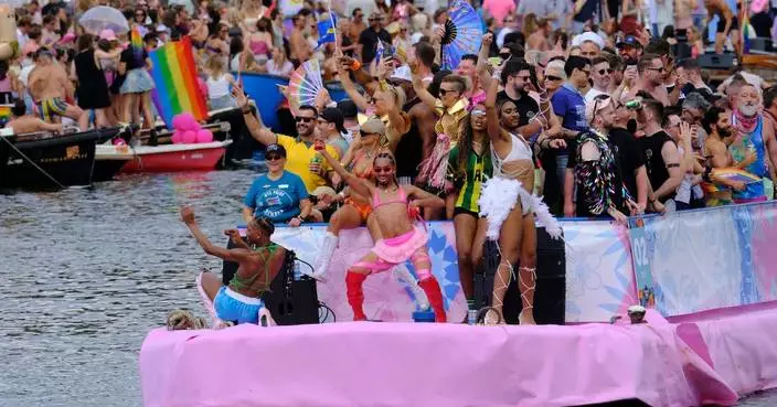 Hundreds of thousands line Amsterdam canals for the annual Pride boat parade