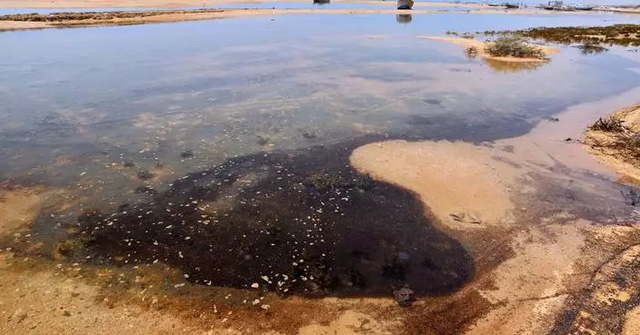 A British firm starts containment of oil spill from stricken tanker off Oman