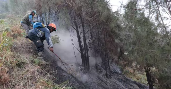 Wildfire at Indonesia's Mount Bromo mostly contained as smoke forces school closures