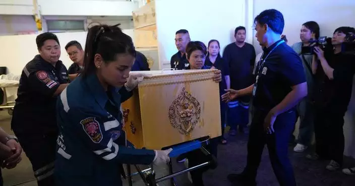 Families retrieve bodies after a 14-year-old killed at least 7 in a shooting outside Bangkok