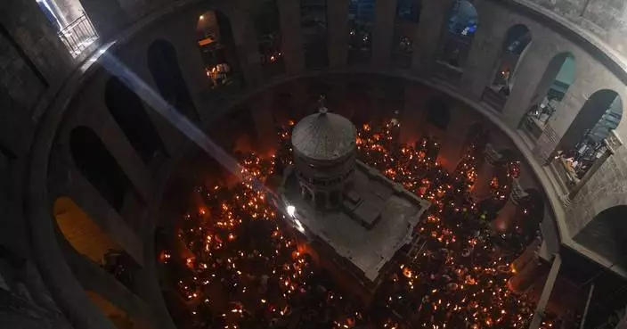 An AP reporter spends the night locked inside Jerusalem's holiest church with clergy and pilgrims