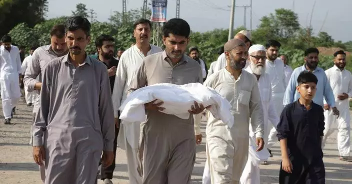 Pakistani investigators visiting hospital nursery where fire killed 14 newborns