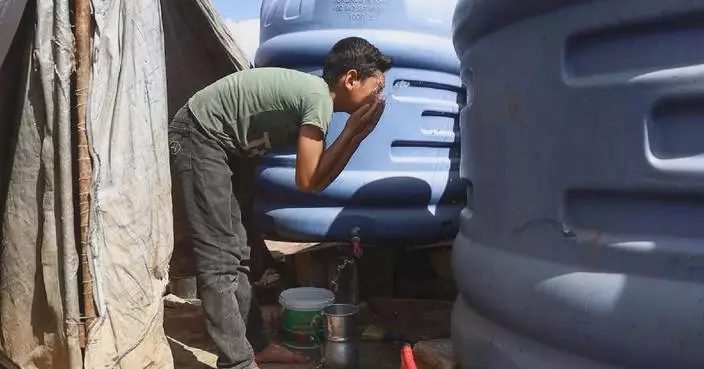 Life in Syria's refugee camps turns perilous as summer temperatures soar