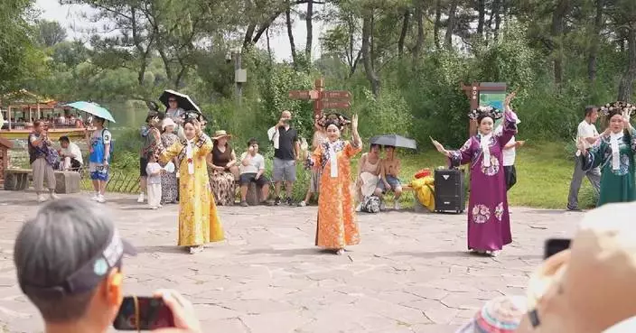 Global travelers explore China's cultural heritage amid cool mountain air