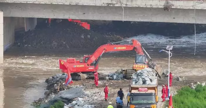Rescuers race to seal levee breach in central China's Henan