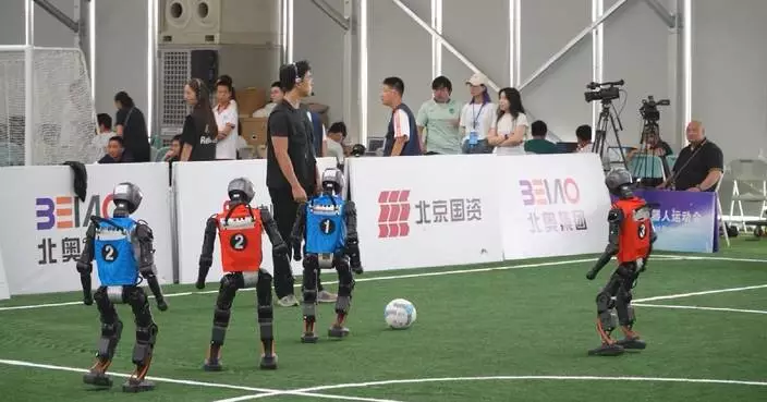 Chinese university students explore cutting-edge models in robot football matches