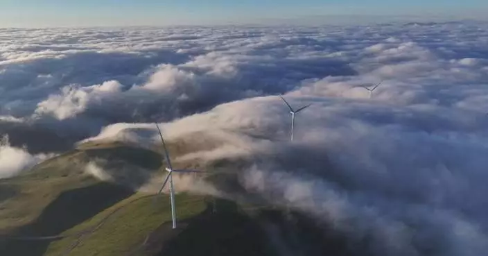 Cloud sea, wind turbines create stunning scene in Gansu