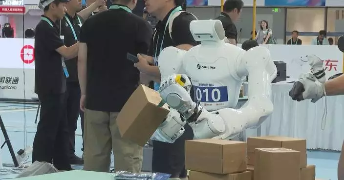 Robots race to unpack boxes at Humanoid Robot Games, showcasing delicate manipulation