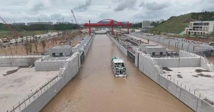 China's major river-to-sea canal completes first passenger vessel trial run ahead of official opening
