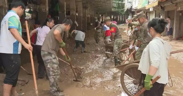 Guangxi rescuers, residents join forces to clear mud, rebuild after floods