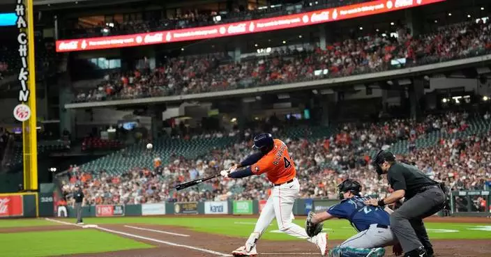 Walker’s 10th-inning 3-run blast lifts the Astros past the Mariners 10-7