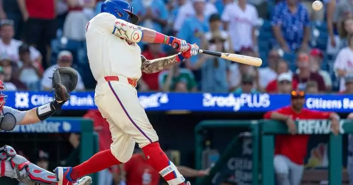 MLB home run leader Schwarber punctuates Phillies' unlikely comeback win over the Cardinals