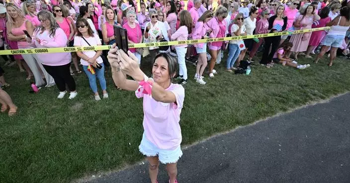 Women in pink rally in support of Lindsay Clancy who is on trial for killing 3 children