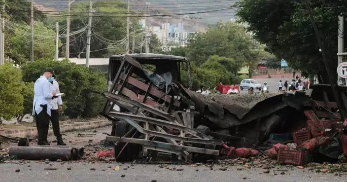 Truck explodes outside Colombia police base, injuring 11 officers and killing a dog