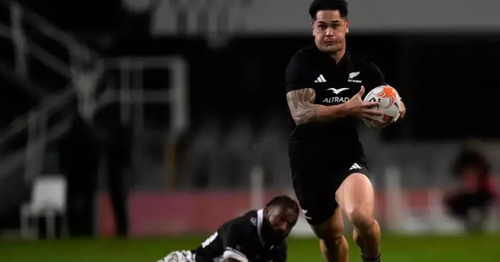 All Blacks wash away the Sharks 54-0 in rain-soaked Durban as McKenzie limps off