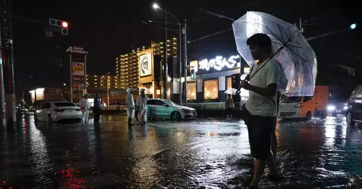 Heavy rain causes flooding near Tokyo that kills 4 and strands travelers
