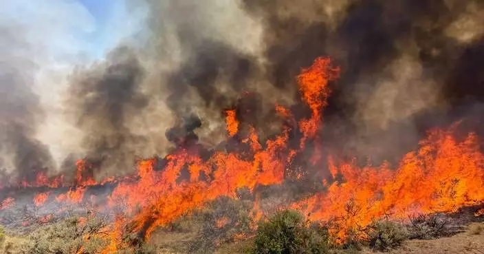 A helicopter battling a Utah wildfire crashes with no word on the 2 people aboard