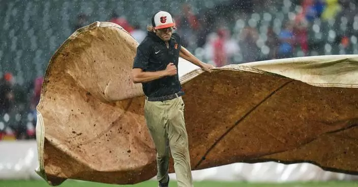 Phillies rout Orioles 8-0 in a game called by rain after 5 1/2 innings