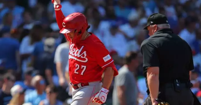 Reds hit 4 homers, score 9 unanswered runs to beat wild card-leading Cubs 10-8