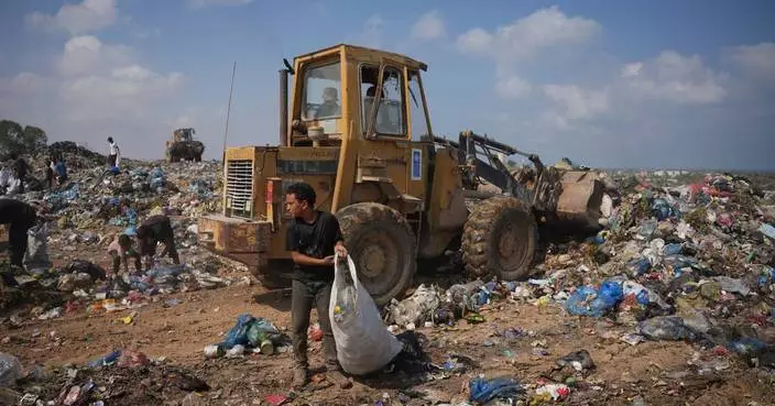 Palestinians in Gaza scavenge trash for things to burn to cook meals, in photos