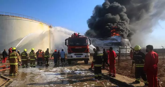 Drone strikes hit Libya's key western oil town and a car bomb kills an officer in the east