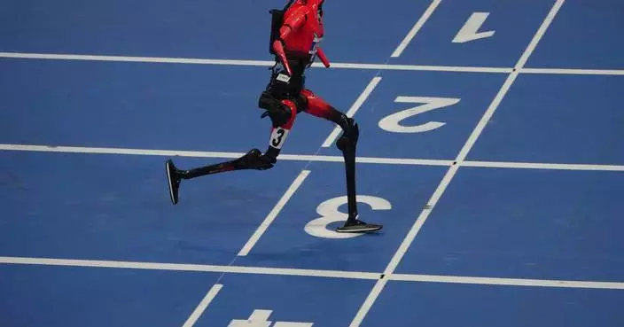 Humanoid robots sprint, play soccer and set records at Beijing games, in photos