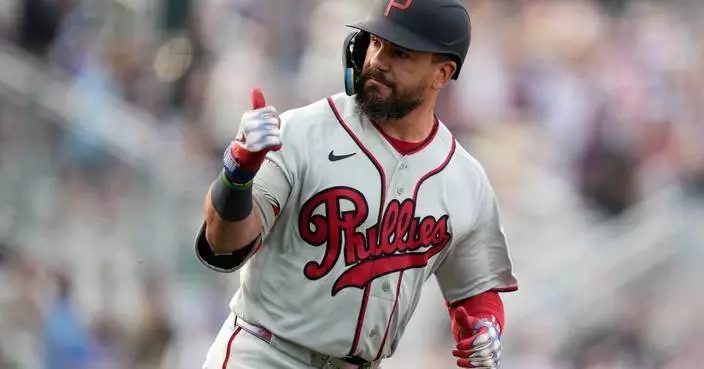 Phillies homer 3 times into the Field of Dreams corn in 7-1 win over Twins, with pair from Schwarber