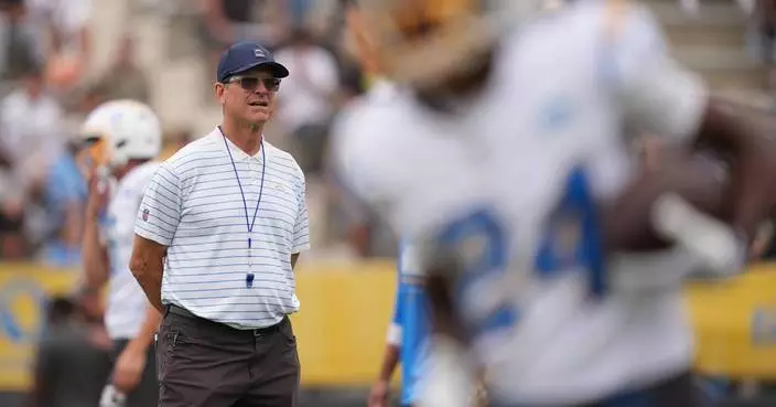 Harbaugh's Chargers honor late Billy Ray Smith before practicing in San Diego