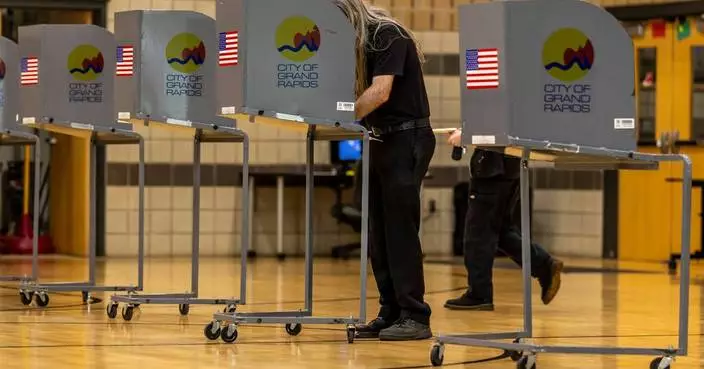 The Latest: Michigan Democratic Senate primary is test between progressives and the establishment