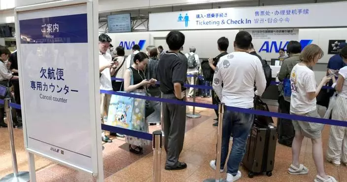 Tropical storm hits Tokyo area, leaving thousands without power before moving west
