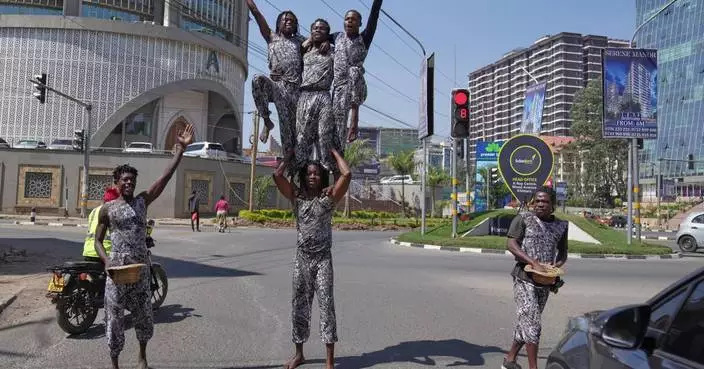 Street acrobats entertain motorists stuck in the Kenyan capital's notorious traffic