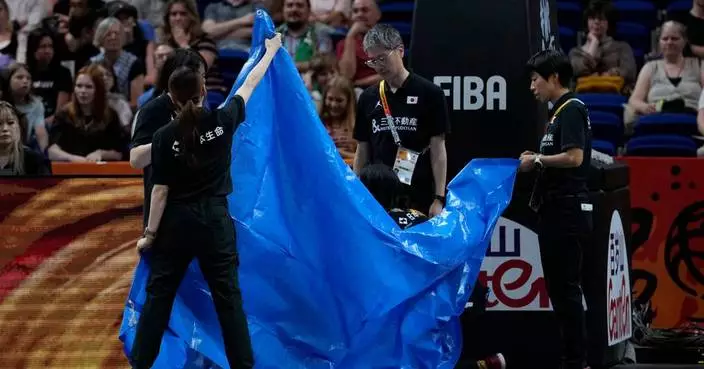 Japan's Saki Hayashi goes off with suspected broken arm at women’s FIBA World Cup