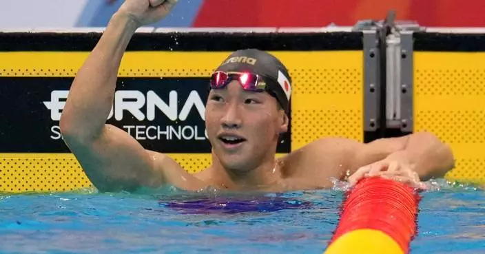 Shin Ohashi of Japan sets world record in 200-meter breaststroke at the Asian Games