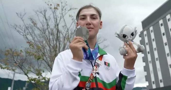 Afghan female cyclist wins silver at Asian Games after disguising herself as a man to train