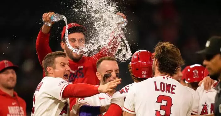 Angels blow 9th-inning lead, then rally for 2 in the 10th to edge Twins 5-4