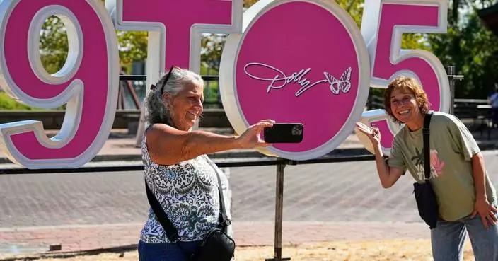 It's officially Dolly Parton Day, with parades, pink lights and book drives