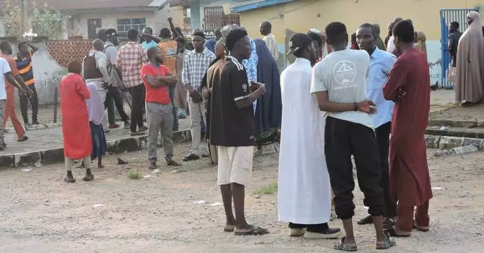 Nigerian police use tear gas during protests over the deaths in custody of 37 miners