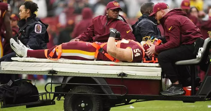 Washington LB Leo Chenal carted off with a neck injury against Seattle