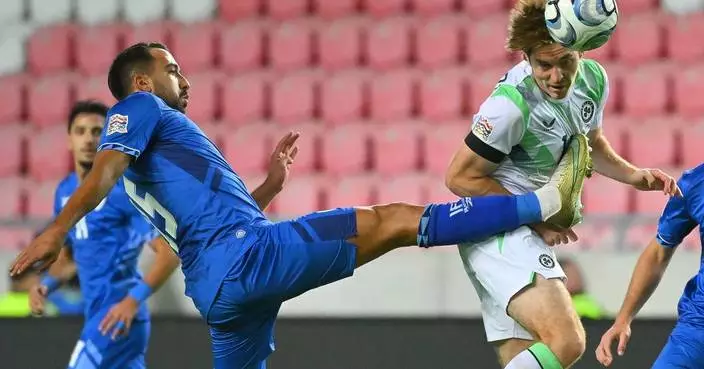 Ireland players wear black armbands and refrain from handshakes in soccer game against Israel