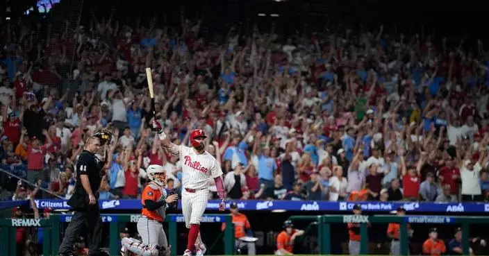 Schwarber hits grand slam for 44th homer in Phillies' 11-7 win over Astros