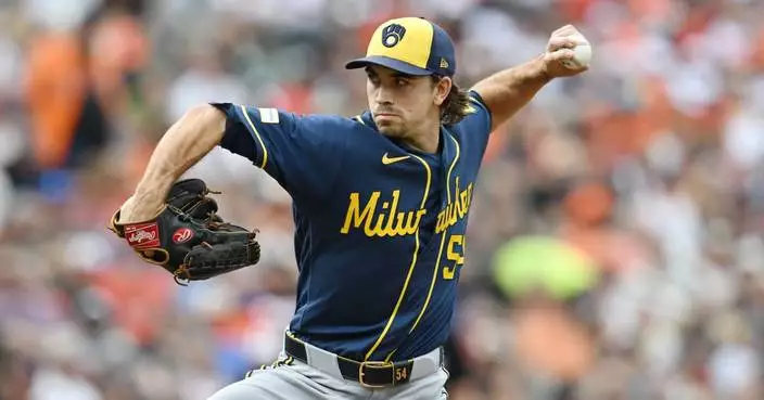 Brewers tie team record with 97th win, beat Orioles 1-0 with help of fly ball lost in sun