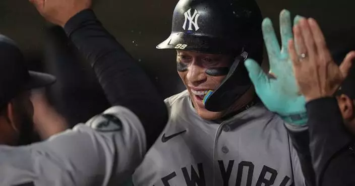Judge's first homer since May 24 helps clinch postseason berth for Yankees in 8-3 win at Twins