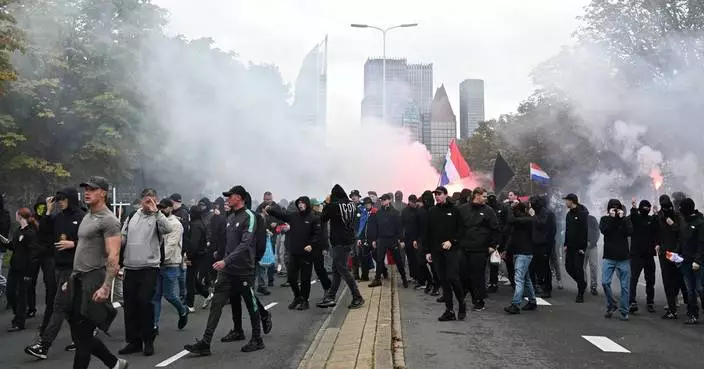 Dutch riot police break up far-right protest in The Hague after violence erupts