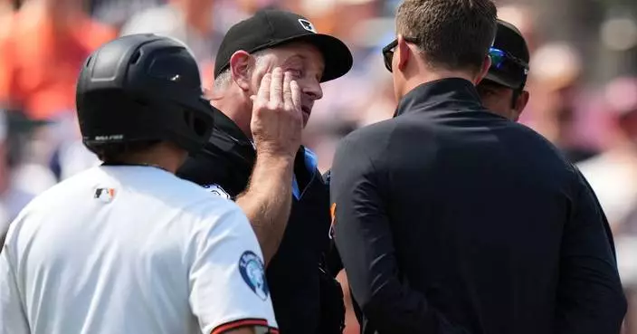 Plate umpire Chris Guccione leaves Orioles-Guardians game after being hit in the mask by a foul tip