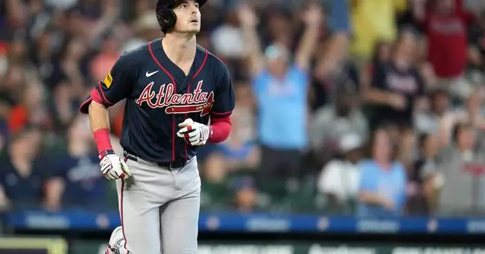 Yastrzemski hits a 3-run homer and the Braves clinch the NL East title with 4-2 win over the Astros