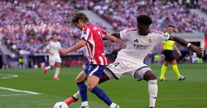 Atletico Madrid beats 10-man Real Madrid 2-1 in derby, Man City outlasts Sunderland in England