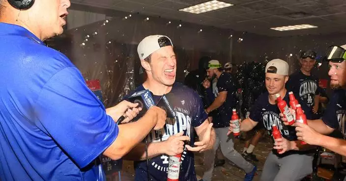 Dodgers clinch a fifth straight NL West title with an 8-2 win over the Reds
